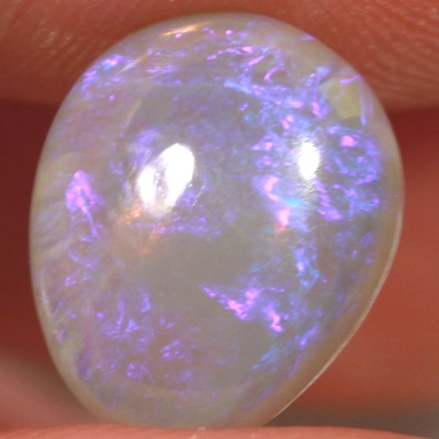 SOLID CRYSTAL OPAL Sparkles of purple over a mauve hue